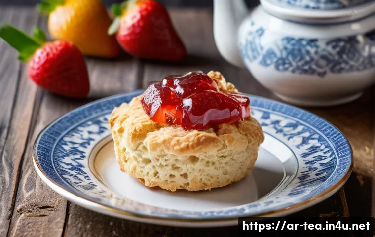 미국 스콘과 머핀 - A close-up view of a traditional scone resting on a delicate white porcelain plate, cut into elegant...
